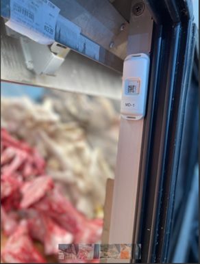 Wireless temperature sensor mounted in a meat display case