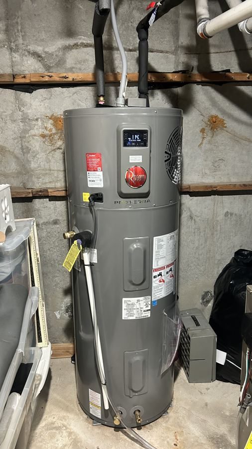 Rheem ProTerra heat pump water heater installed in a basement mechanical space